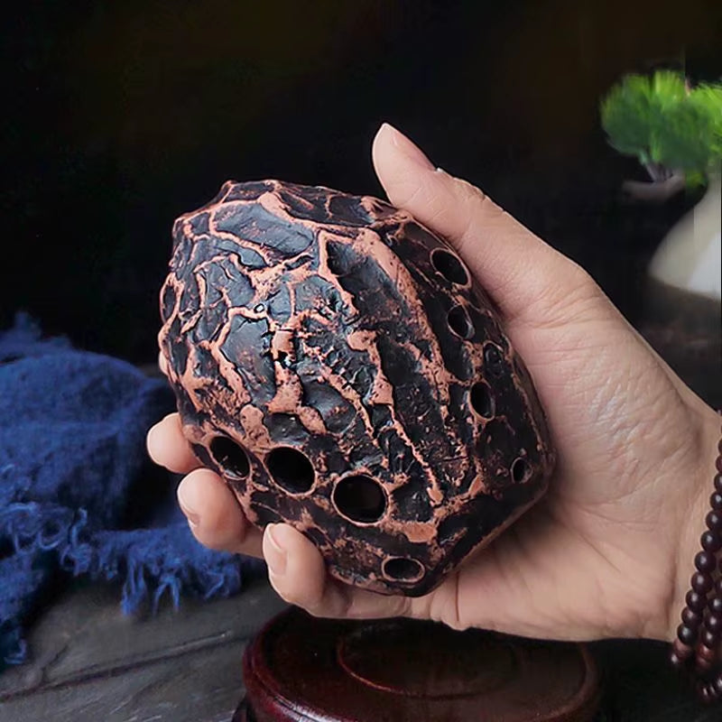 Textured copper egg-shaped Xun with crackled honeycomb pattern for music enthusiasts