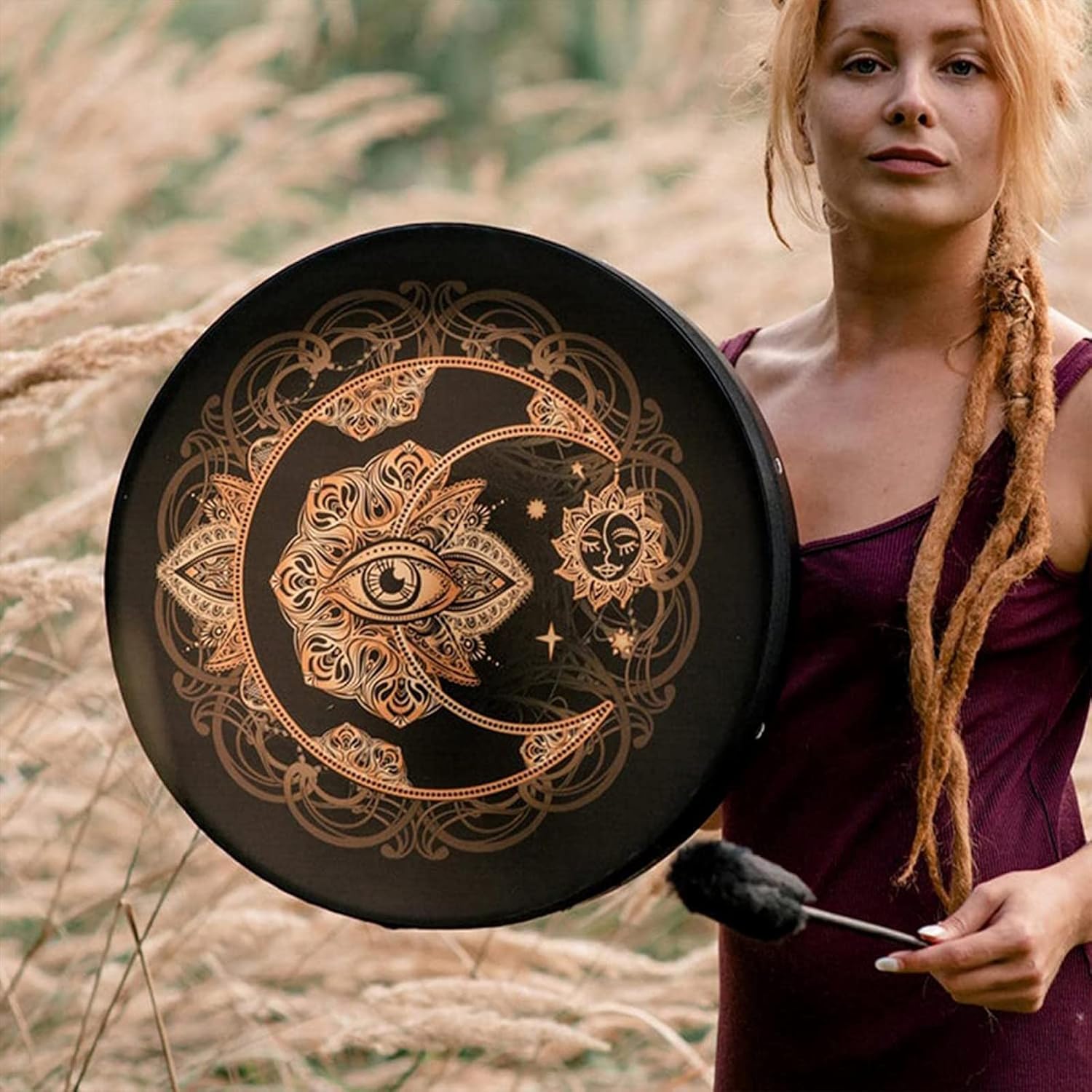 Black drum with golden celestial design, moon and eye pattern for spiritual sound healing