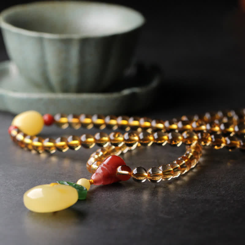 Mala-Armband mit 108 Perlen aus Citrin und Bernstein für den Frieden