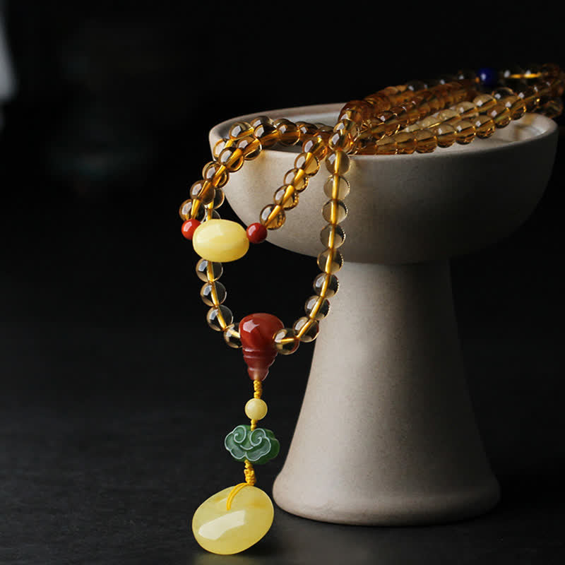 Mala-Armband mit 108 Perlen aus Citrin und Bernstein für den Frieden