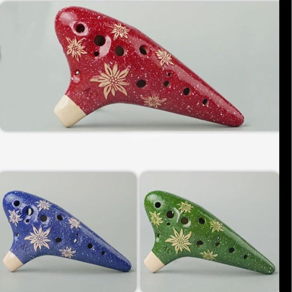 Ceramic ocarinas with snowflake patterns in red, blue, and green for Zelda fans