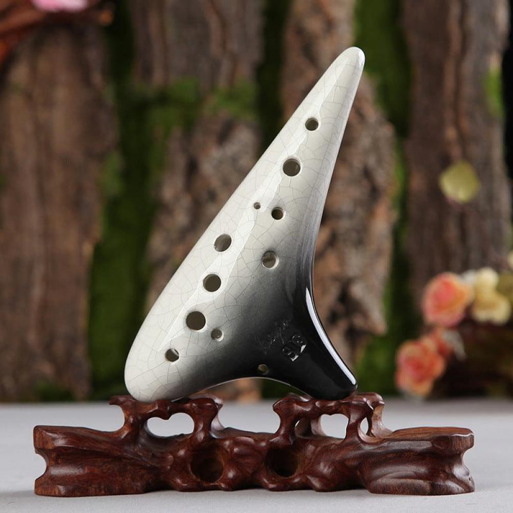 White ceramic 12 Hole Soprano Treble Ocarina on decorative wooden stand