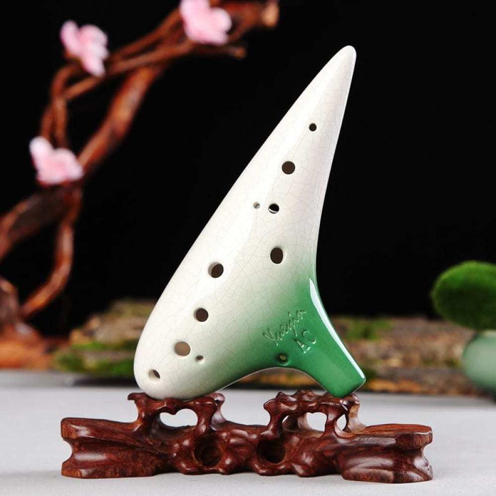 White and green ceramic ocarina on wooden stand in 12 Hole Tenor Alto C Ceramic Ocarina Flute