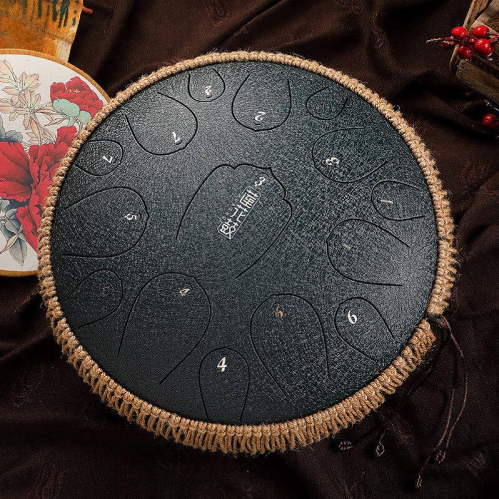 14-Inch Carbon Steel Tongue Drum with numbered zones and woven rope trim