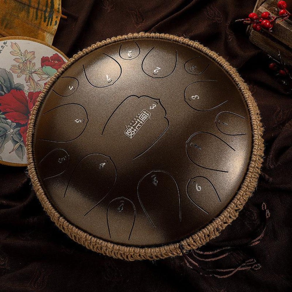 14-Inch Carbon Steel Tongue Drum with numbered tone zones and woven rope trim