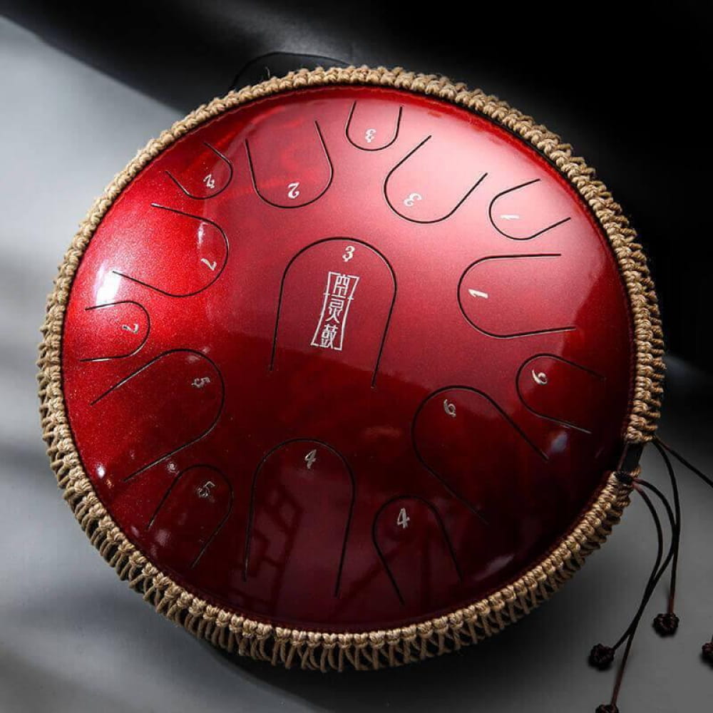 Red metallic tongue drum with woven rope edging in 14 Inch Titanium Steel design
