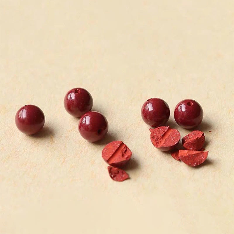 Zinnoberarmband und Fußkettchen mit Glücksbringerschnur