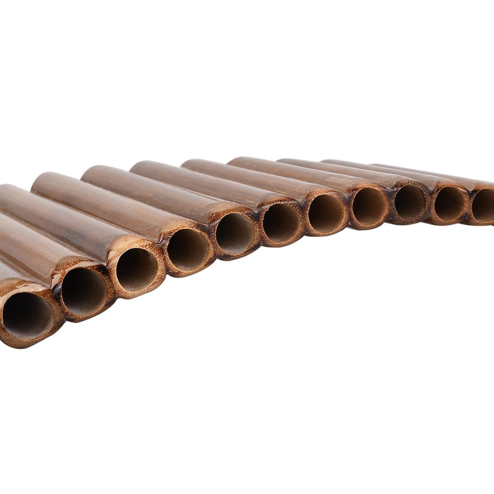 Row of hollow chocolate wafer sticks in descending order beside 15 Pipe Bamboo G Key Pan Flute