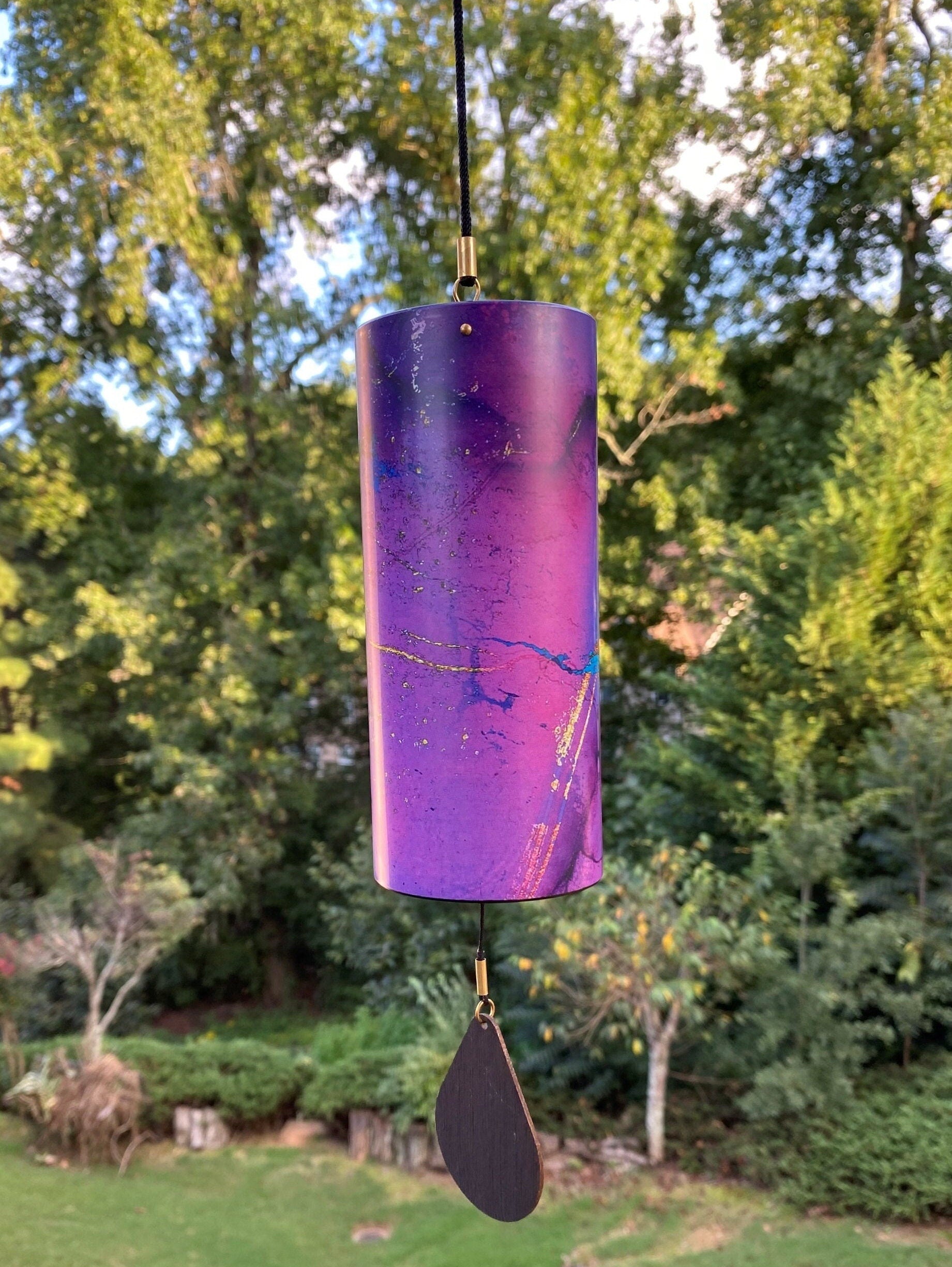 Purple metallic wind chime with paddle for home and garden relaxation decor