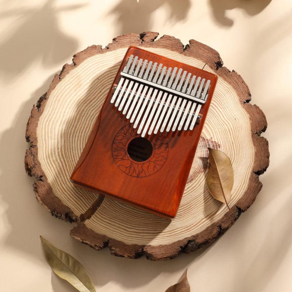 Wooden Kalimba with metal tines on tree ring slice, 17 Key Acacia Armrest design