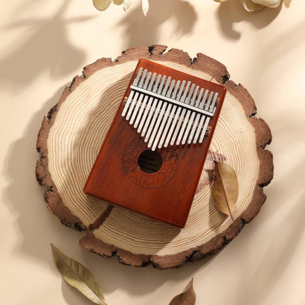 Wooden Kalimba with metal tines on a round wood slice, 17 Key Acacia C Tone