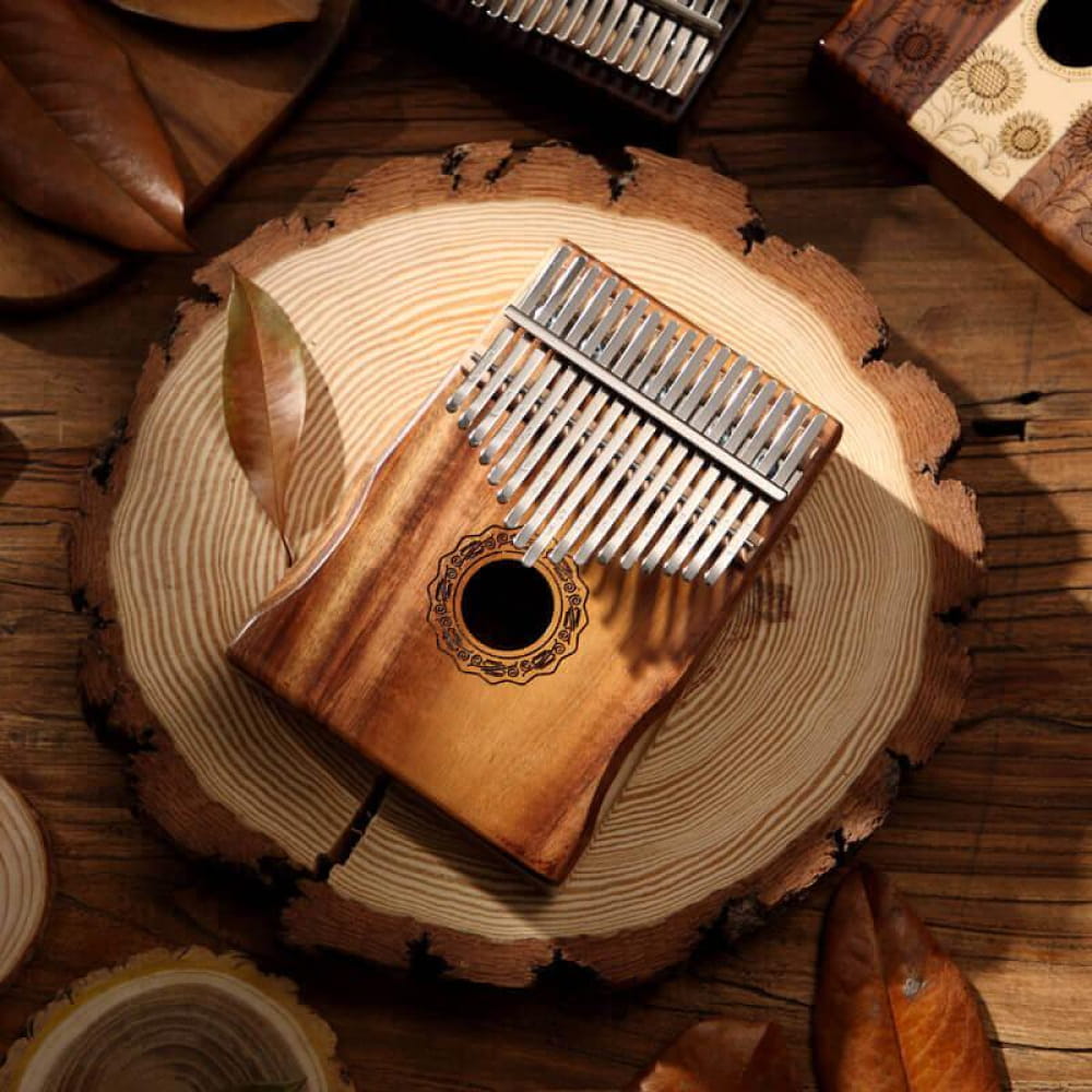 Wooden Kalimba with metal tines and sound hole in 17 Key Acacia Thumb Piano