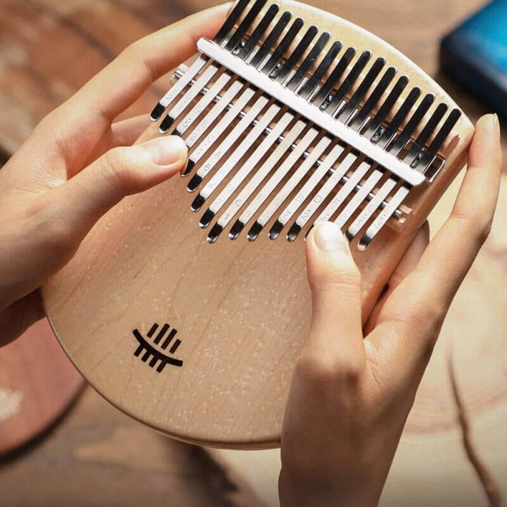 17 Key Maple C Tone Kalimba Thumb Piano with metal tines on a scalloped board