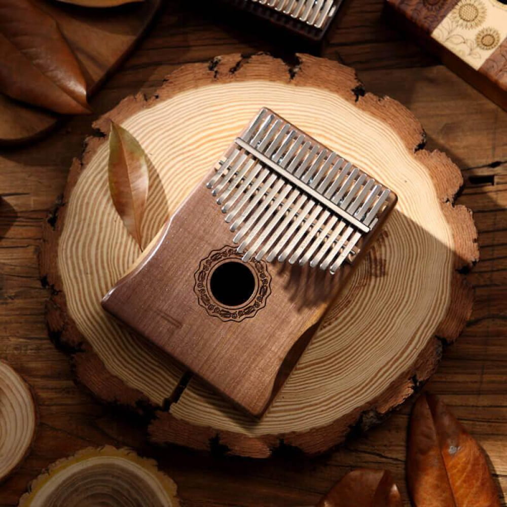Wooden 17 Key Walnut Round Hole Kalimba Thumb Piano with metal tines and decorative sound hole