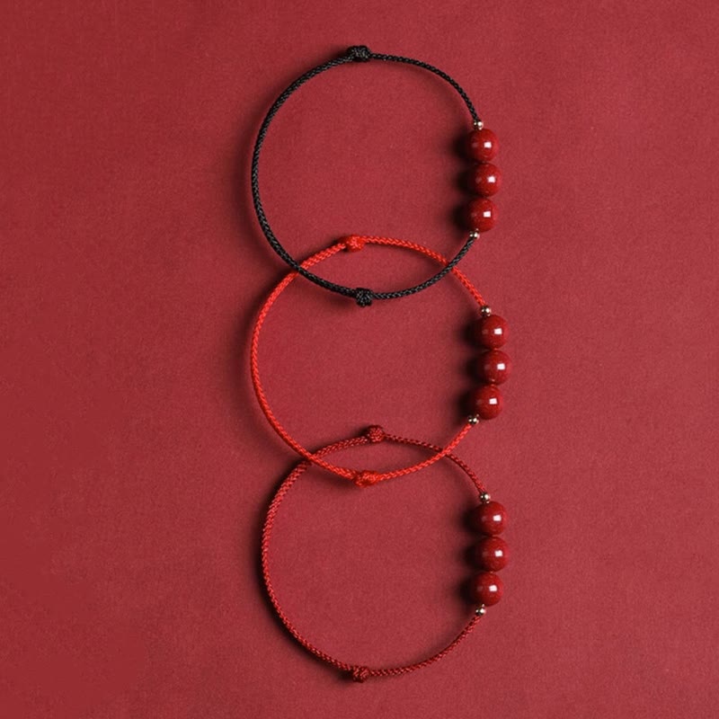 Zinnoberarmband und Fußkettchen mit Glücksbringerschnur