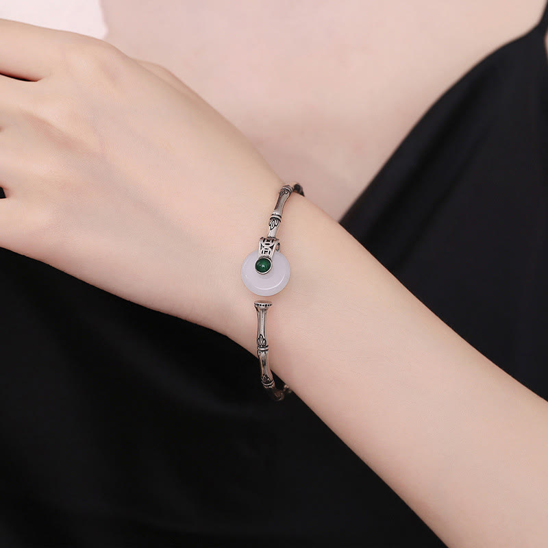 Manschettenarmband aus Kupfer und weißer Jade mit Peace-Schnalle und Bambus-Design
