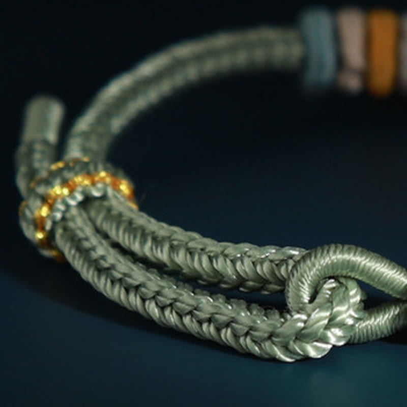 Vierreihiges Pfirsichblüten-Verbindungsarmband mit roter Schnur