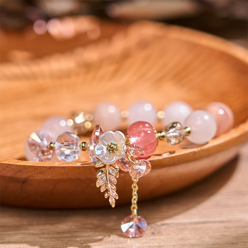 Heilarmband mit mehreren Steinen und Blumenakzenten