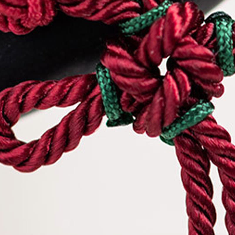 Ebenholz-Haarnadel mit roter Schnurquaste für Schutz und Glück