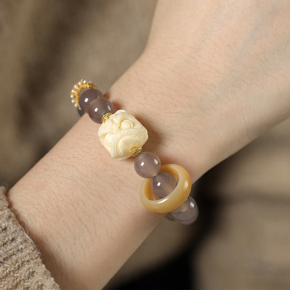 Elfenbeinfarbenes Frucht-Amber-Grau-Achat-Armband für Selbstvertrauen