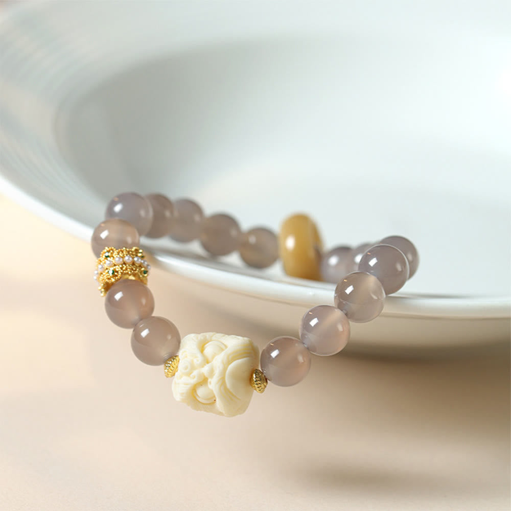 Elfenbeinfarbenes Frucht-Amber-Grau-Achat-Armband für Selbstvertrauen