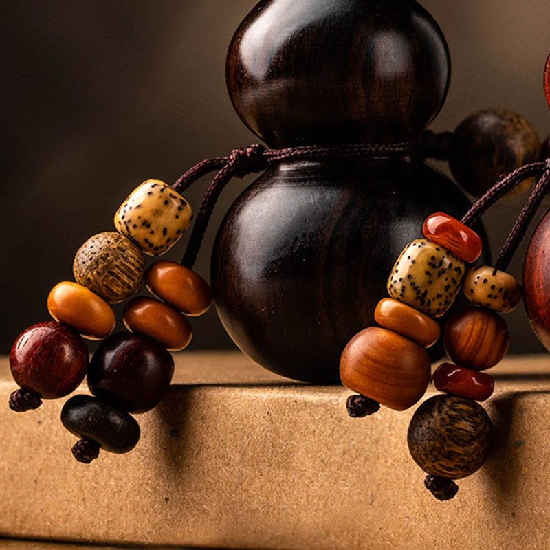 Schlüsselanhänger aus Kürbis aus Ebenholz und rotem Sandelholz für Glück und Schutz