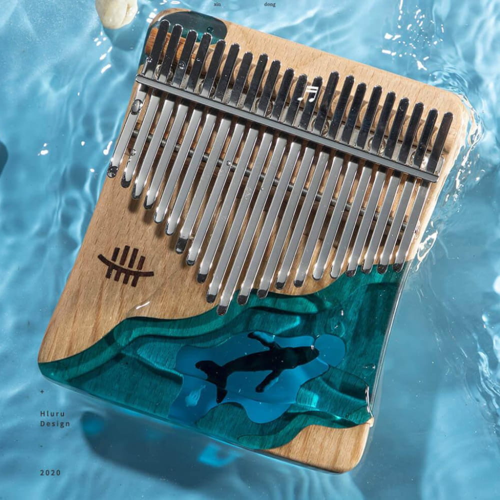 Wooden Kalimba with turquoise ocean waves and dolphins design on Deep Sea Blue base