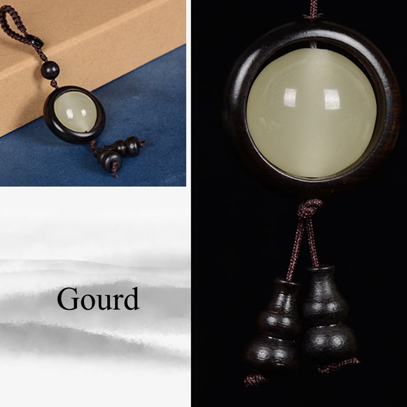 Schlüsselanhänger aus Ebenholz mit Peace-Zeichen | Leuchtperlen aus rotem und grünem Sandelholz