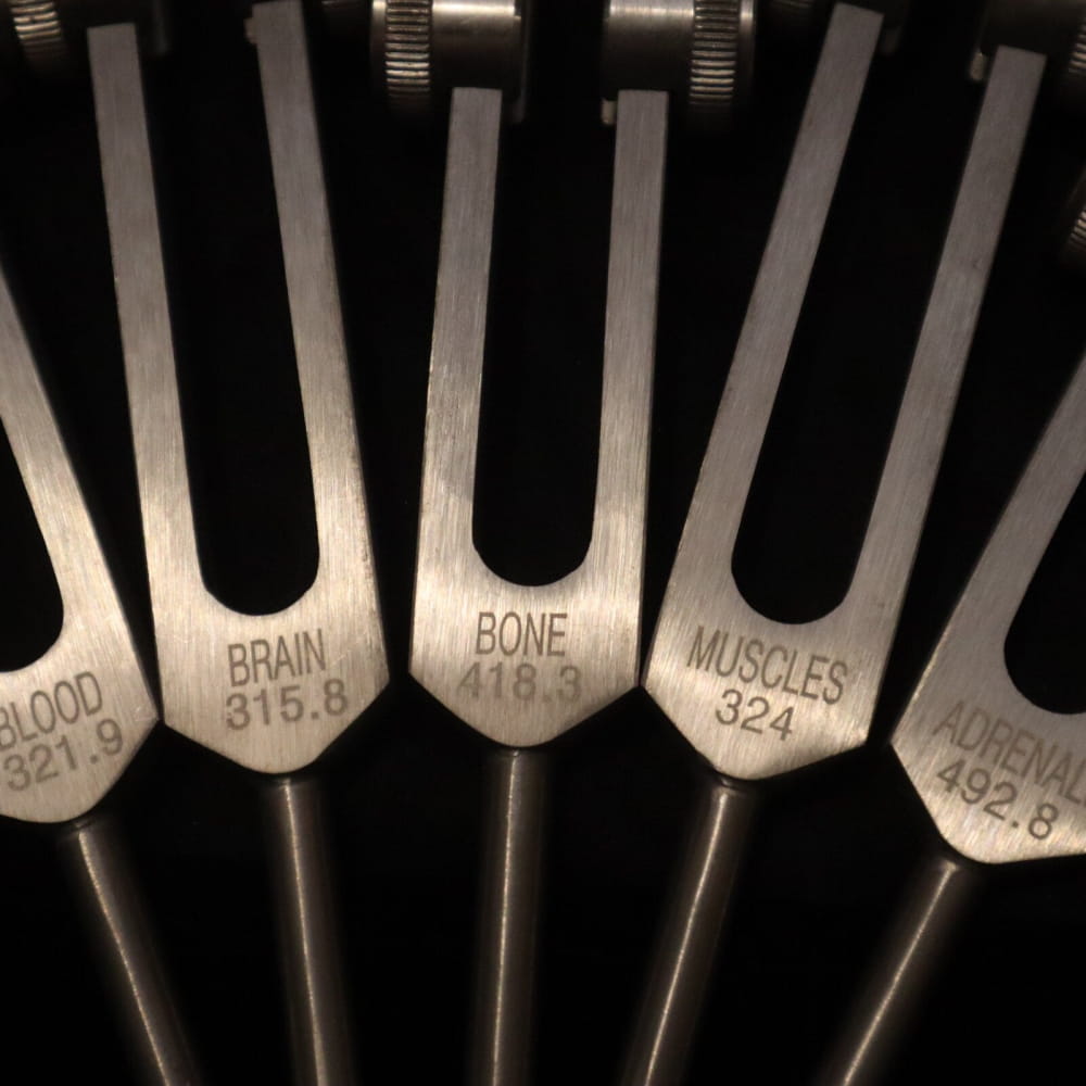 Medical tuning forks labeled for sound healing frequencies in 24pc Solfeggio Set