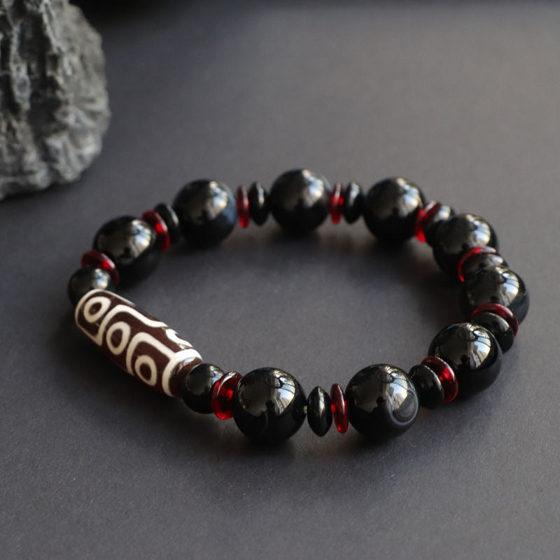 Schwarzes Onyx-Neun-Augen-Dzi-Perlen-Schutzarmband
