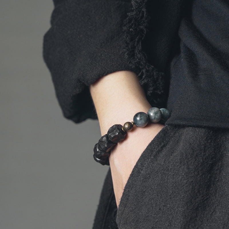 Paararmband aus Adlerauge-Stein mit Ebenholz und Kupfer