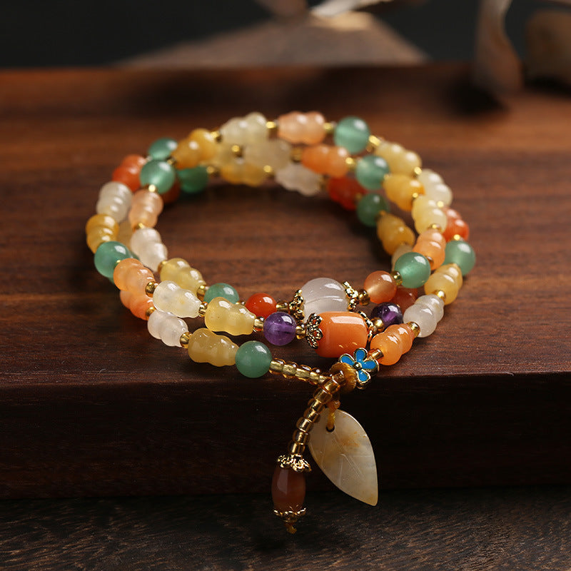 Goldenes Seiden-Jade-Kürbis-Reichtumsarmband 10 mm Unisex