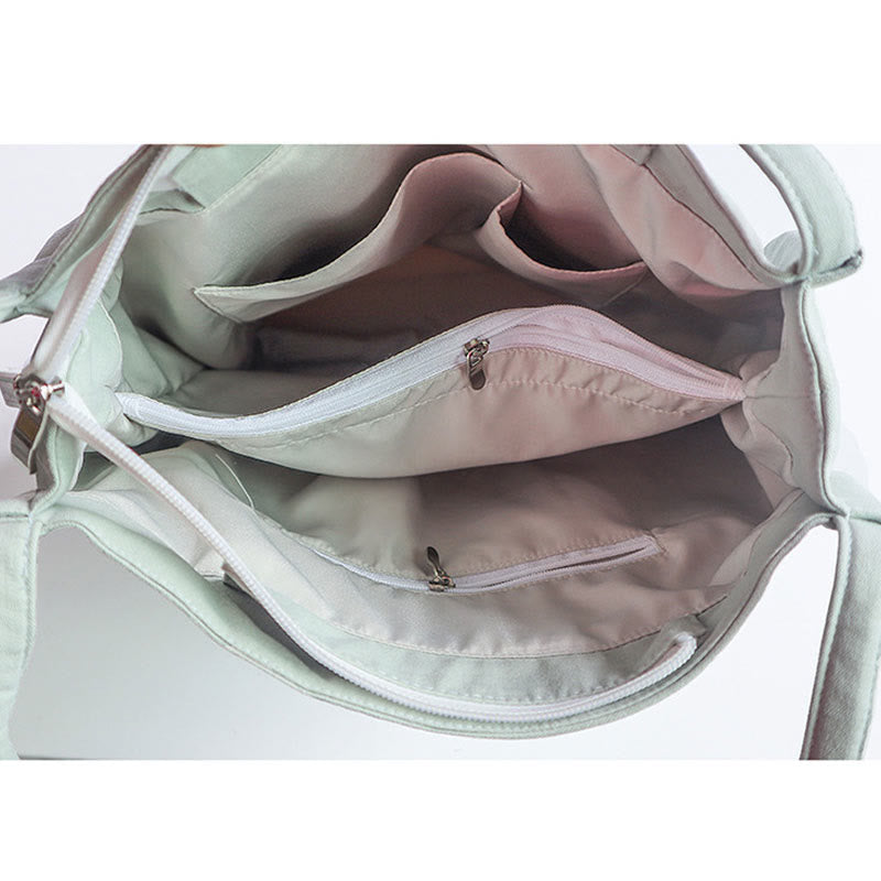 Canvas-Tragetasche mit Blumenkranich- und Pflaumenblüten-Stickerei