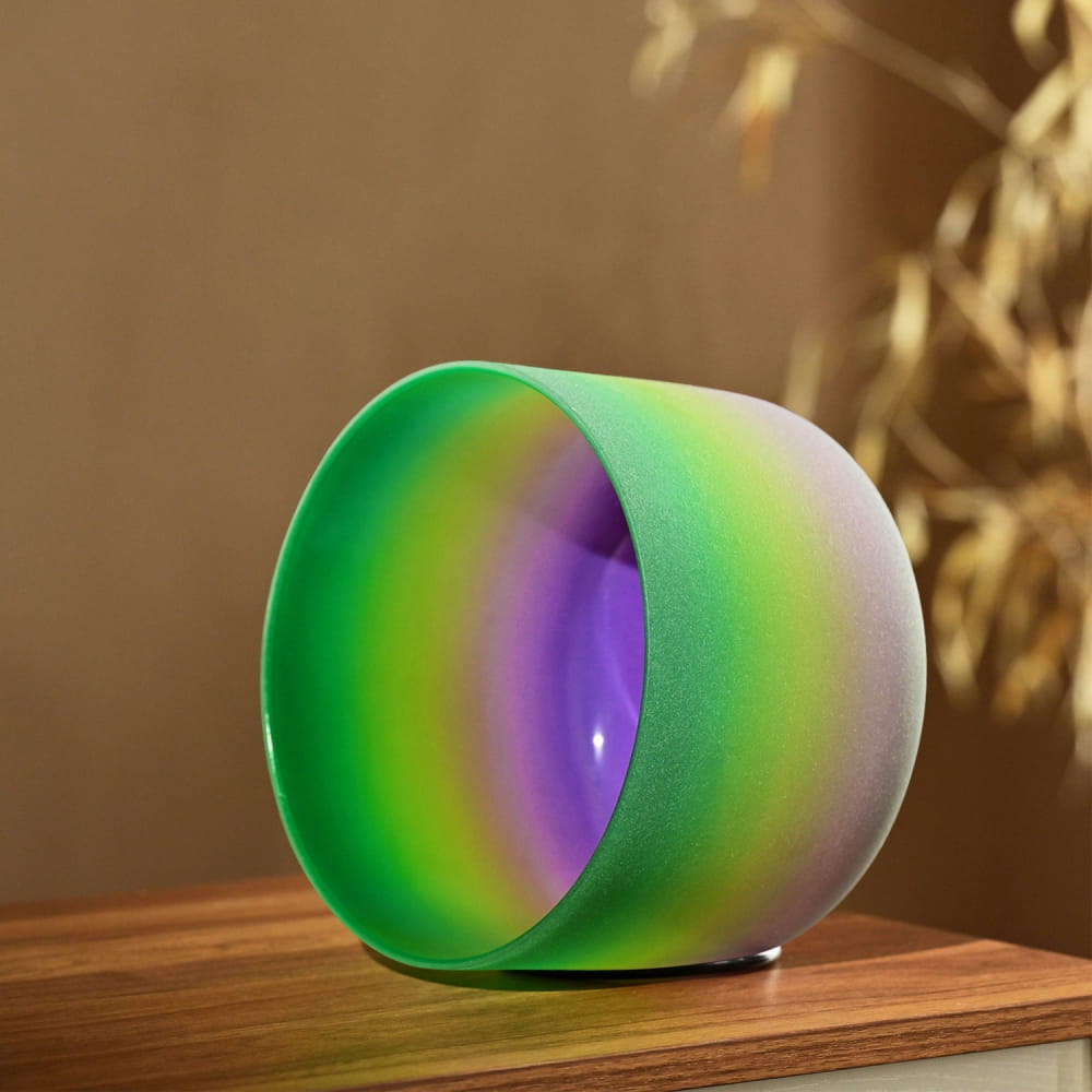 Cylindrical color-changing LED lamp transitioning from green to purple in 440Hz F Note bowl