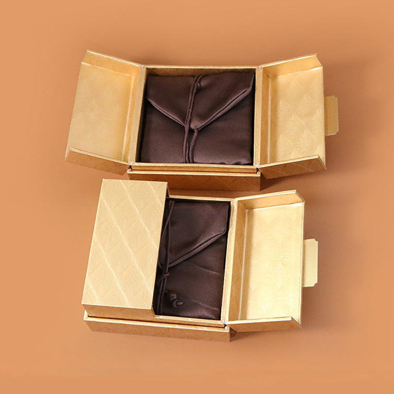 Goldene Zen-Schmuckaufbewahrungsbox mit Federmuster