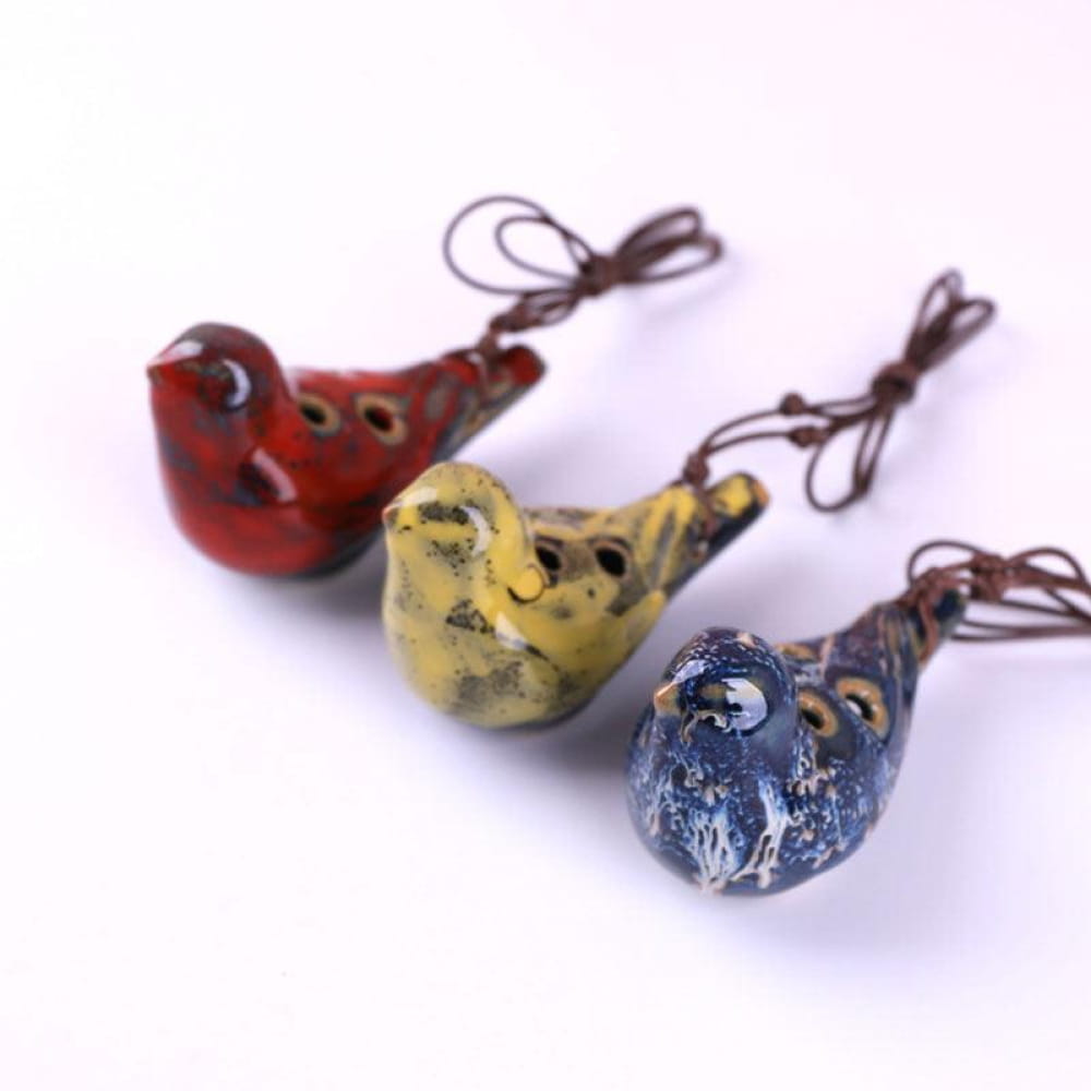 Ceramic bird-shaped ocarina whistles in red, yellow, and blue for beginners