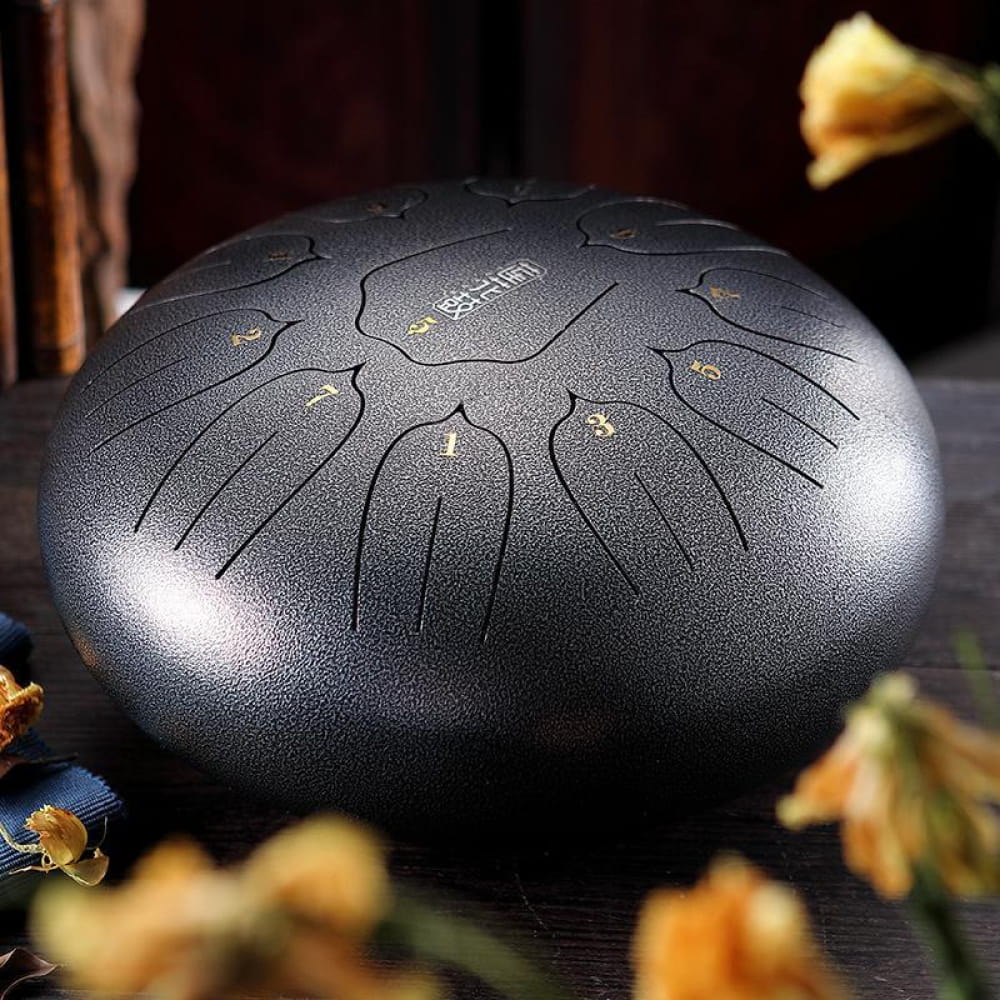 Steel tongue drum with matte black finish and etched tone zones for beginners and kids