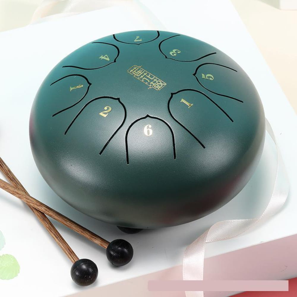 Teal steel tongue drum with numbered sections and two mallets for beginners and kids