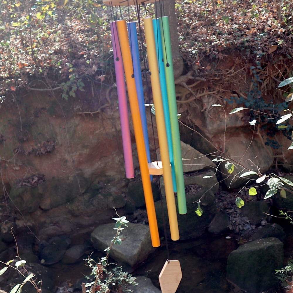 Colorful bamboo wind chimes hanging from a string in 6-Tone Solfeggio Wind Chime Set