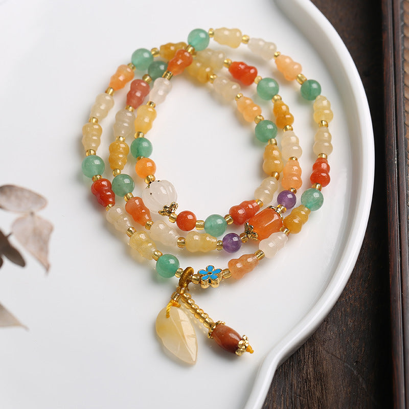 Goldenes Seiden-Jade-Kürbis-Reichtumsarmband 10 mm Unisex