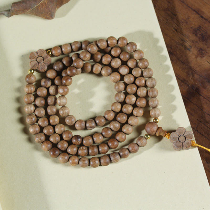 6 mm Sandelholz-Pflaumenblüten-Charm-Mala-Armband für Ruhe und Heilung