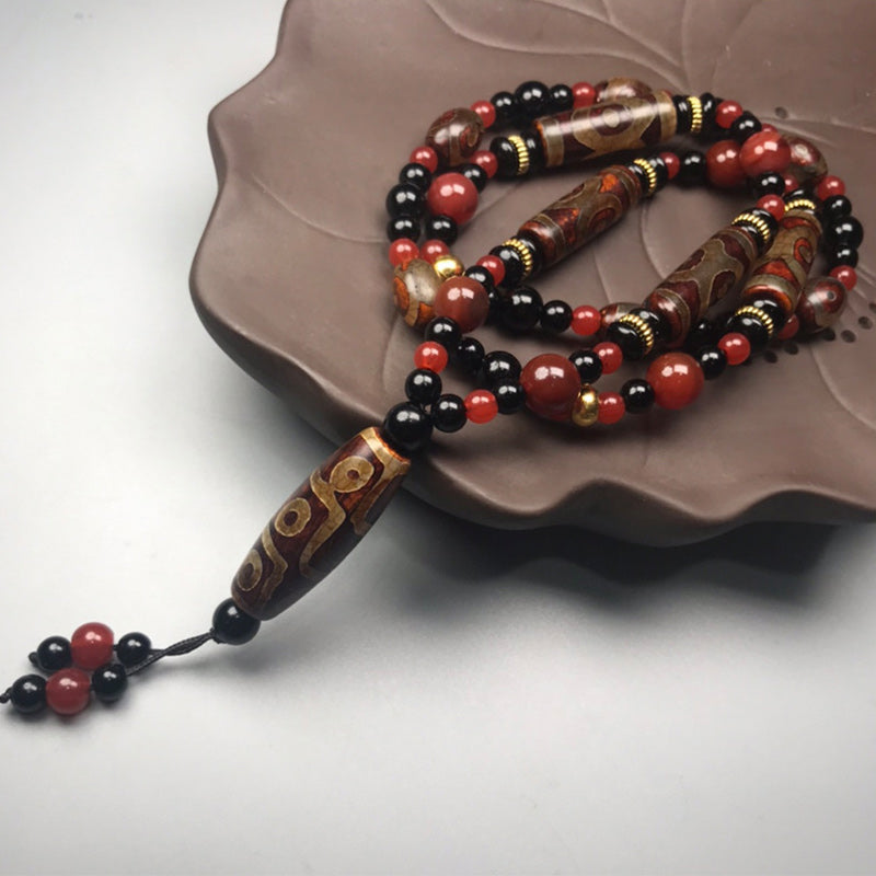 Neun-Augen-Dzi-Perle, roter Achat, 9 x 12 mm, Reichtumskette