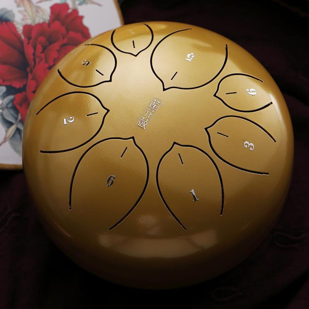Golden Carbon Steel Tongue Drum in F Key with numbered sections in a circular design