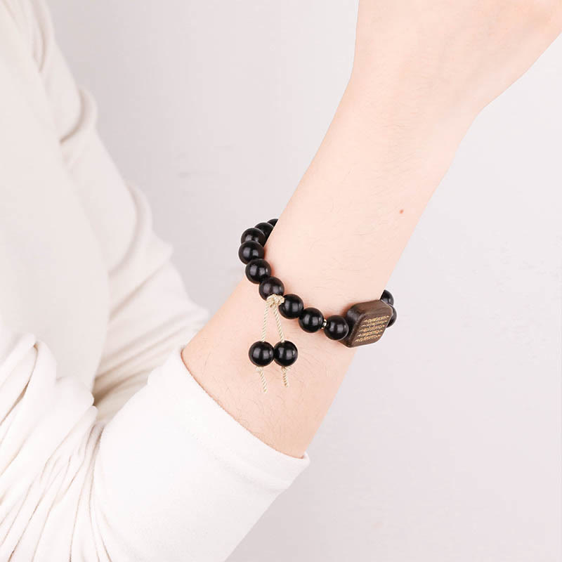 Armband aus Ebenholz mit eingraviertem Schriftzug „Peace“ 14–17 cm