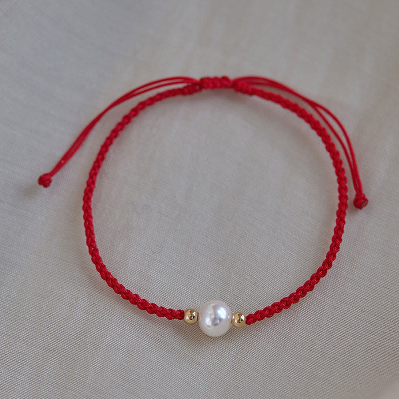 Unisex Perlenarmband mit Glücksbringer auf roter Schnur, 6 mm Perlen