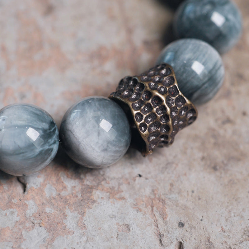 Paararmband aus Adlerauge-Stein mit Ebenholz und Kupfer