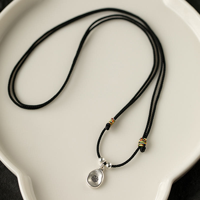 Spirituelle Halskette aus 999er Sterlingsilber mit Peace Joy Fu-Anhänger