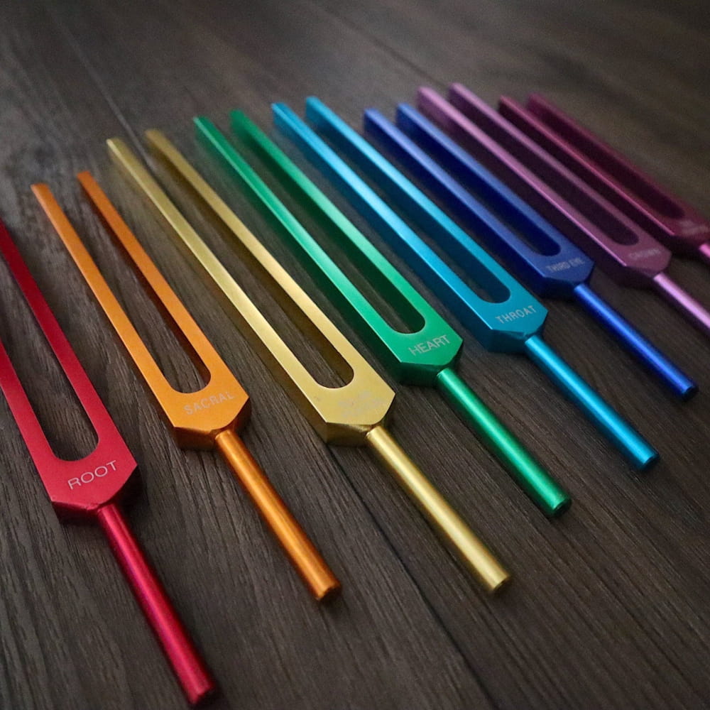 Rainbow-colored tuning forks in a spectrum from the 8pc Chakra Tuning Fork Set