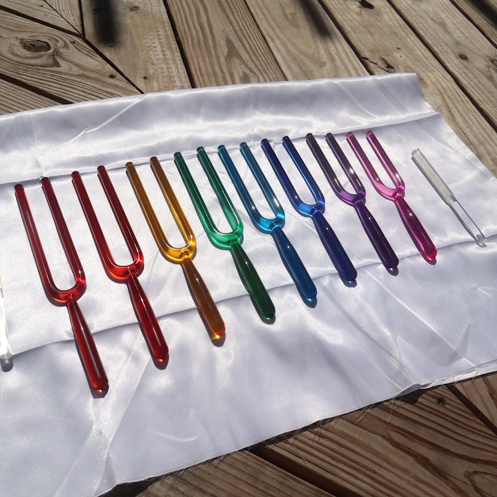 Colorful tuning forks in rainbow order from 8pc Crystal Tuning Fork Set for sound healing