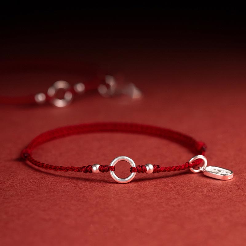 Rotes Schnurarmband aus 925er Sterlingsilber mit Peace Joy Lotus-Schnalle
